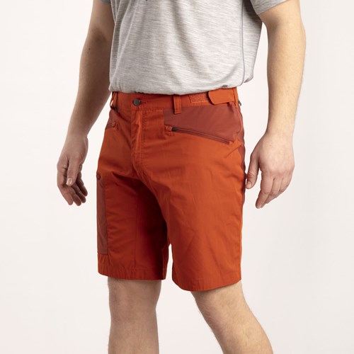 A person wearing orange shorts.