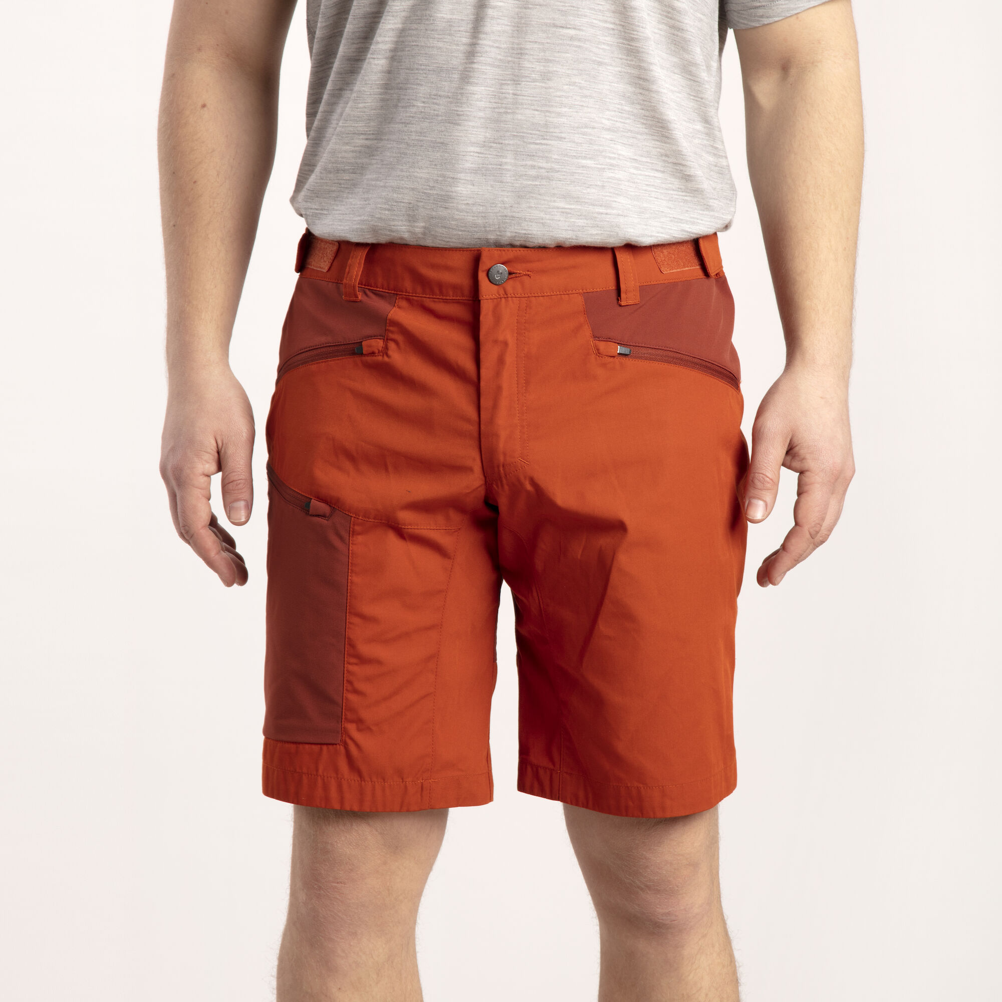A man wearing orange shorts.