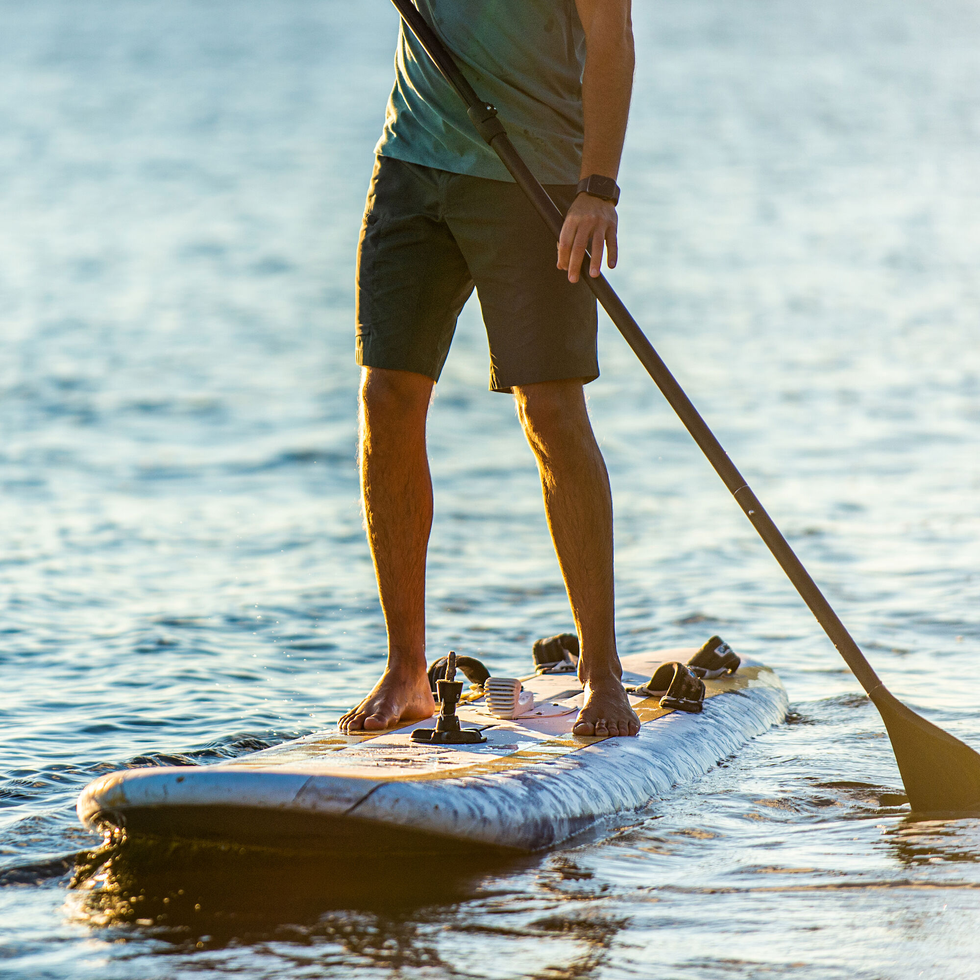 A man paddle boarding on the water.