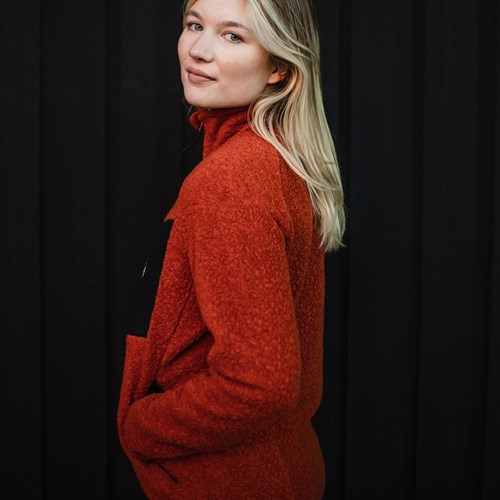 A woman in a red sweater.