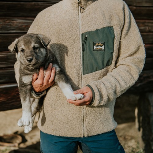 A person holding a dog.