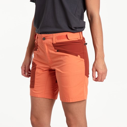 A person wearing orange shorts.