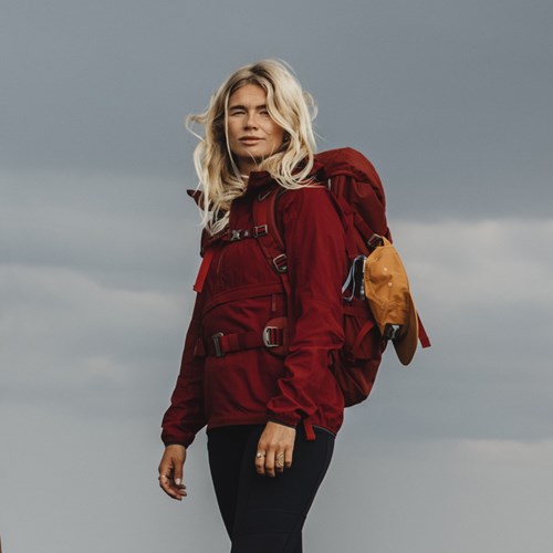 A person wearing a red coat.