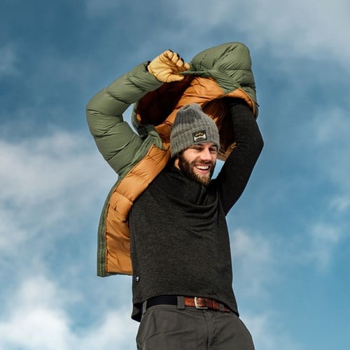 A man carrying a child on his shoulders.
