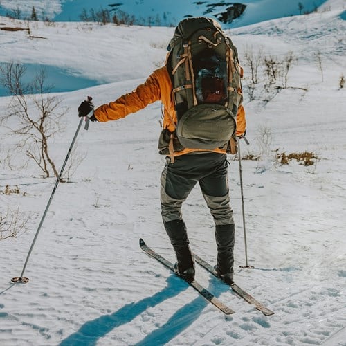 A man skiing on the snow.